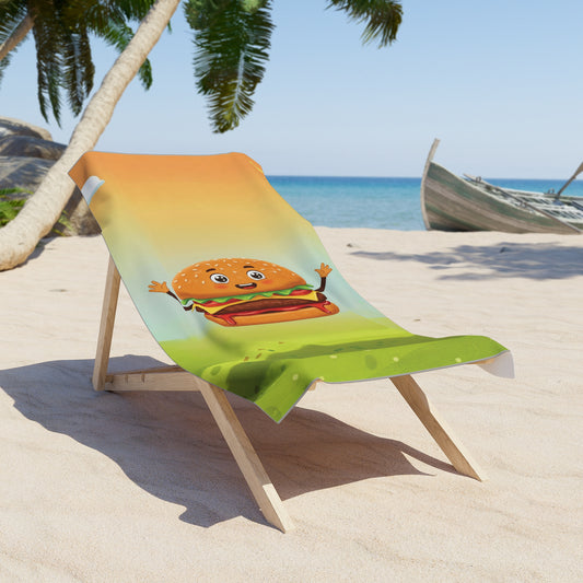 Beach chair with a colorful towel featuring a cartoon hamburger on a sandy beach.