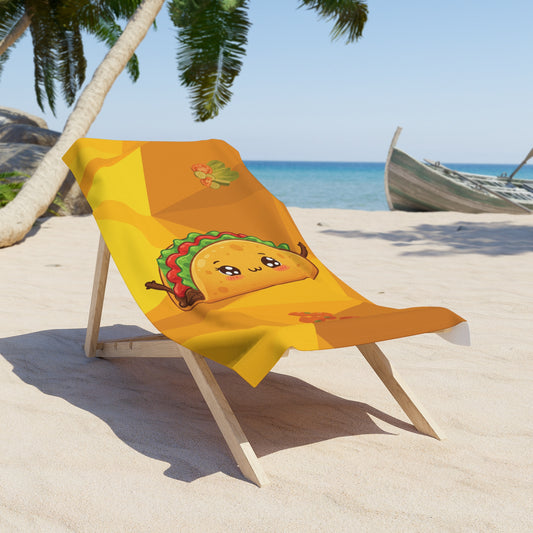 Beach towel with a cartoon taco design on a beach chair at the beach.