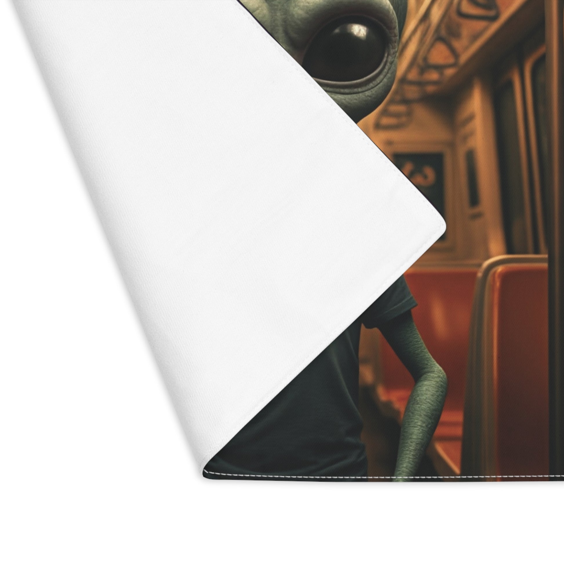 Close-up of a character with green skin and large eyes on a white background