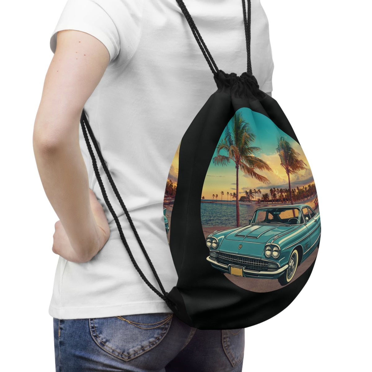 Vintage Cadillac Eldorado drawstring bag featuring retro road trip car art and tropical palm trees.