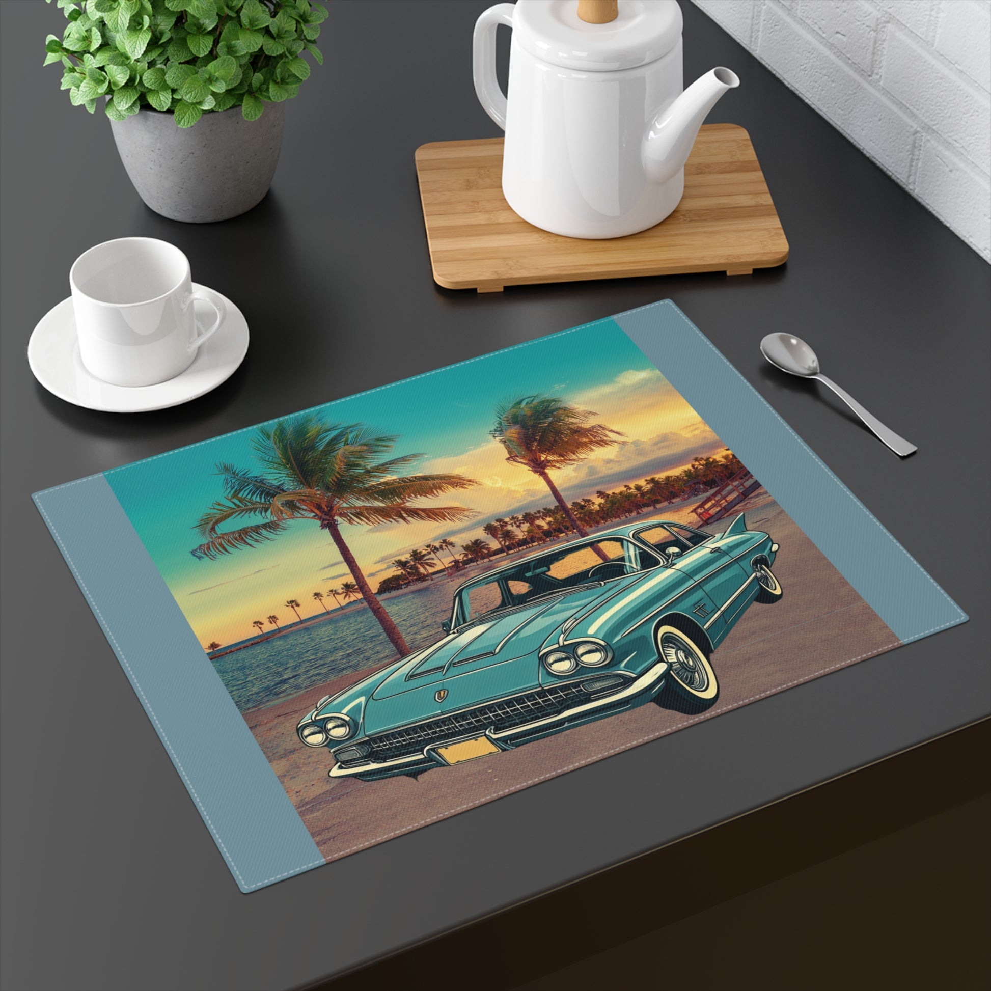 Vintage blue Cadillac Eldorado parked by tropical palm trees at sunset on a cotton placemat.