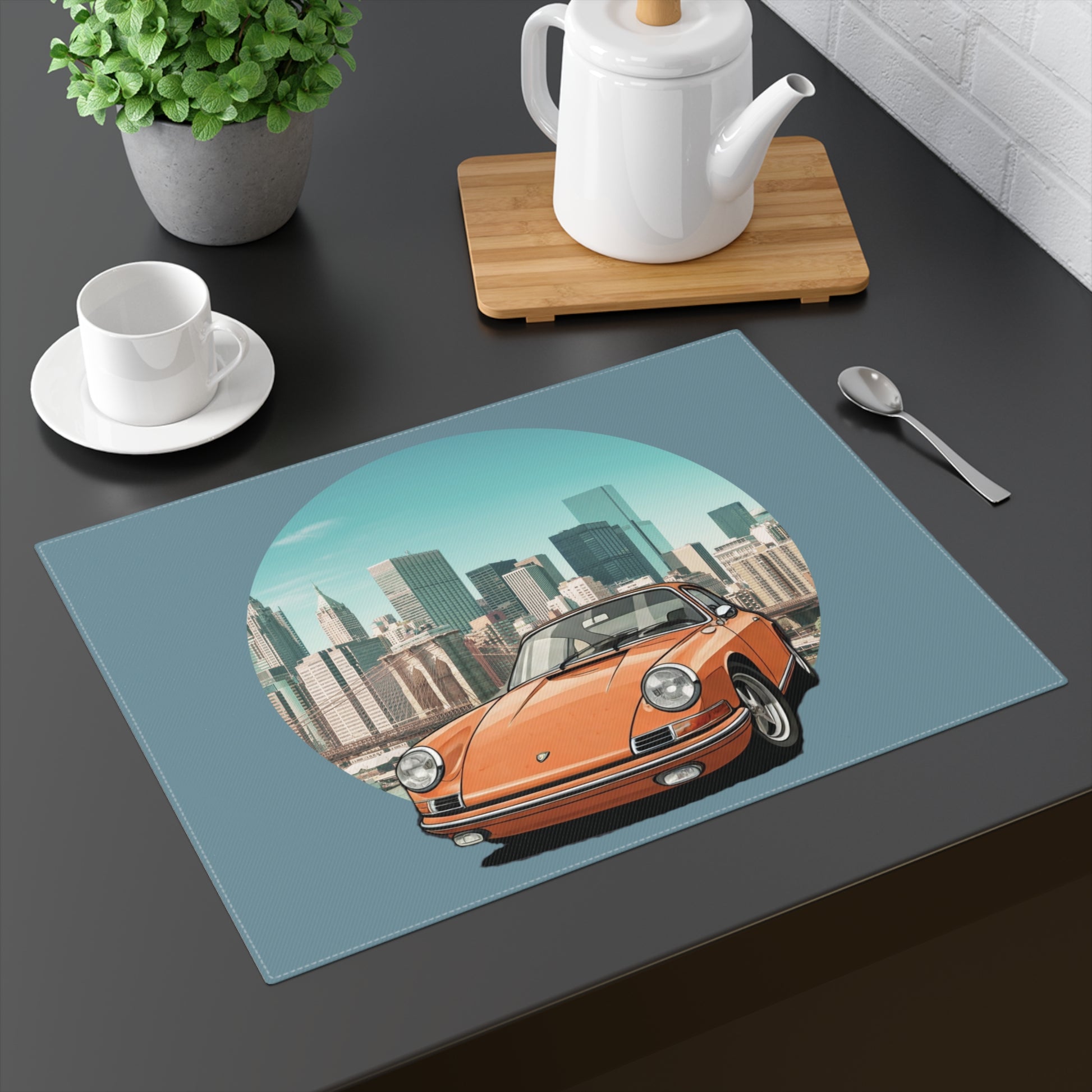 Orange vintage Porsche 911 framed in a circular city skyline on a white cotton placemat.