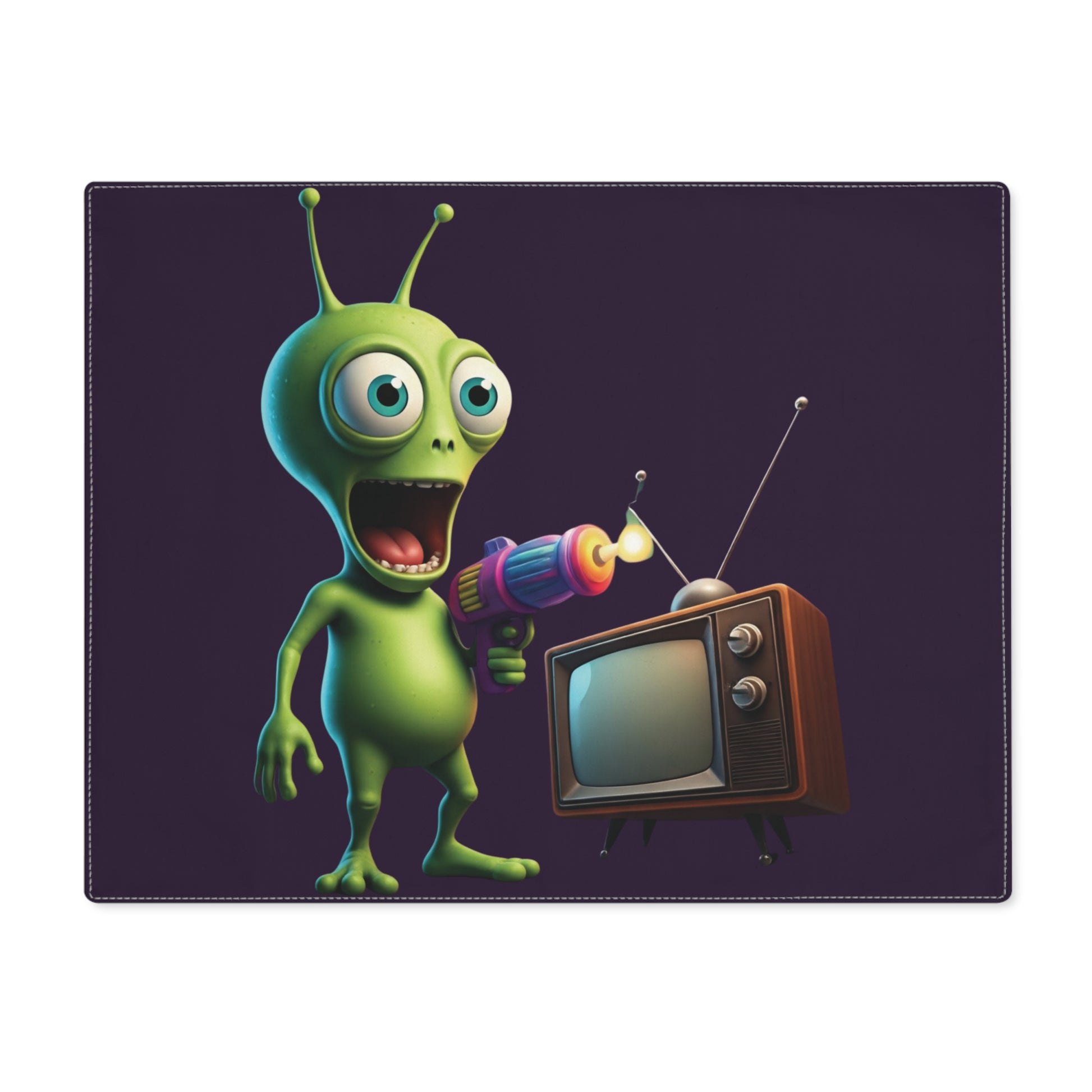 Green alien character with a colorful ray gun pointing at an old-fashioned TV on a placemat