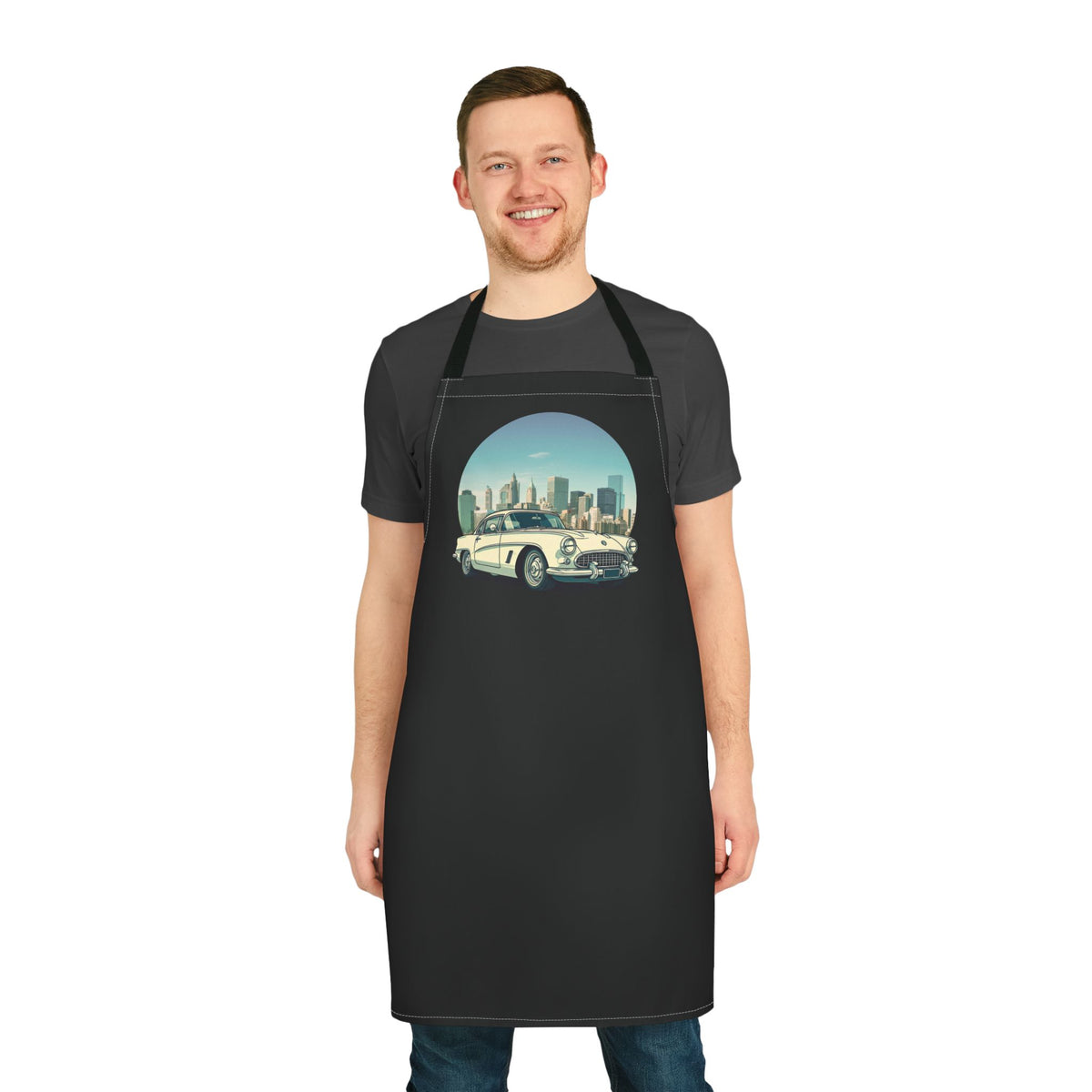 Man wearing a black kitchen apron featuring a classic white vintage car and city skyline graphic from From Space Store.