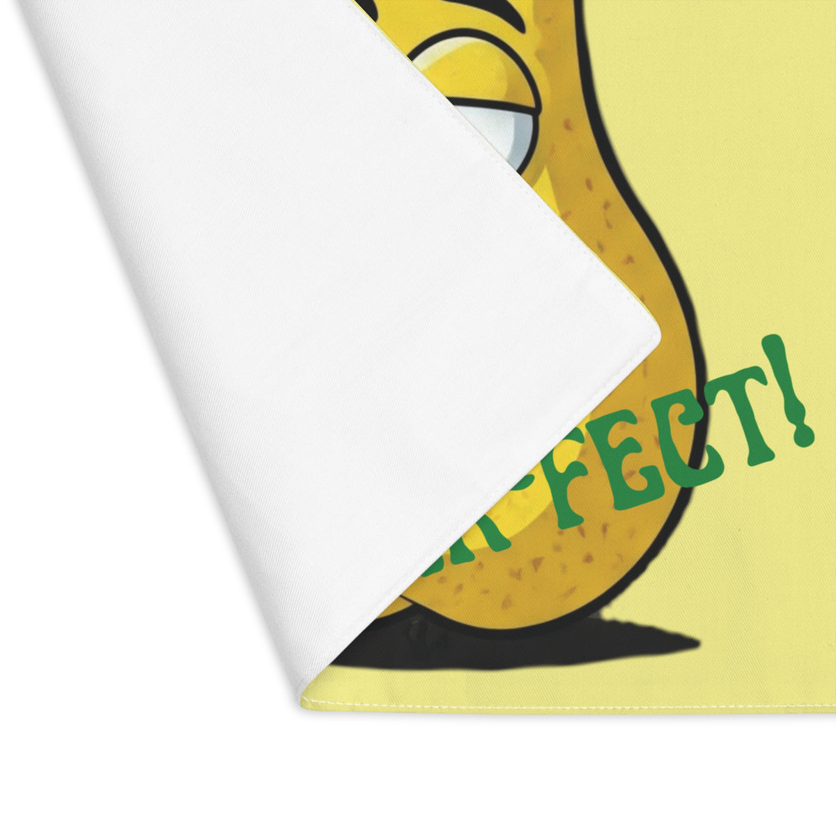Close-up view of the folded corner showing the clean white backside and durable stitched edge of a washable dining table placemat.