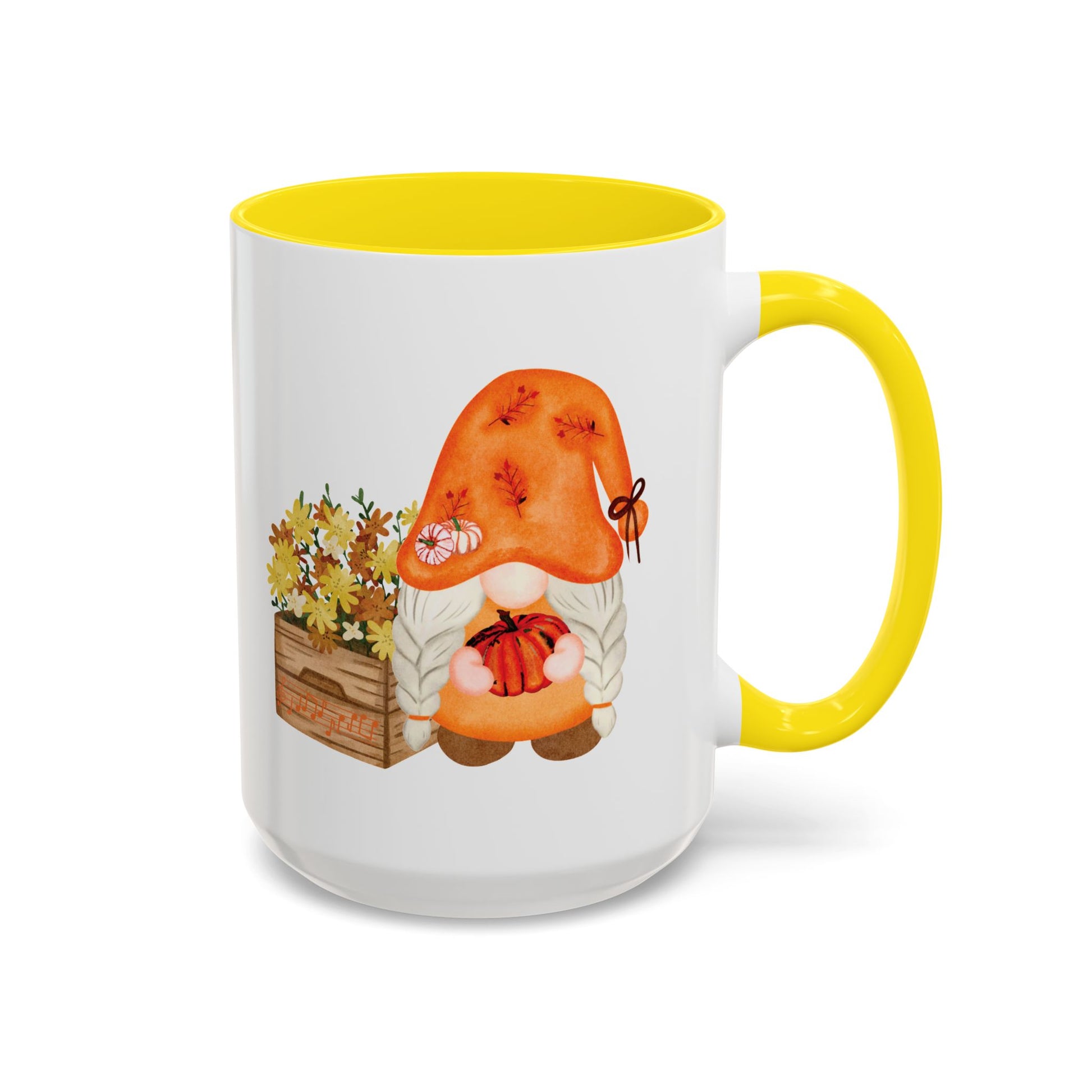 White and yellow ceramic coffee mug with a colorful graphic of a mysterious gnome surrounded by autumn leaves and mushrooms.